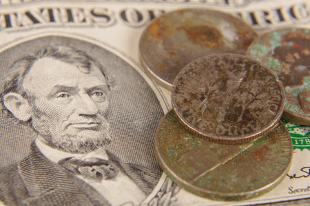 Rusty coins on the old dollar banknote