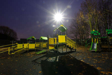 Children playground at nightの写真素材