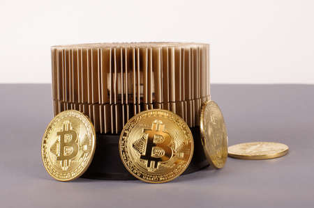 Bitcoin mining device and symbolic coins as a profit conceptの写真素材