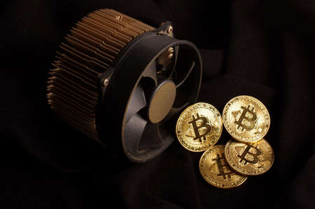 Bitcoin mining device and symbolic coins as a profit conceptの写真素材