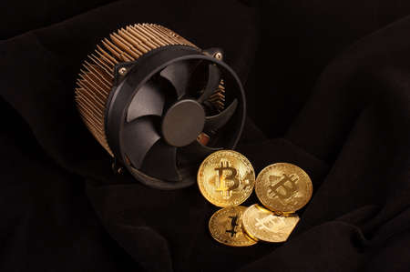 Bitcoin mining device and symbolic coins as a profit conceptの写真素材
