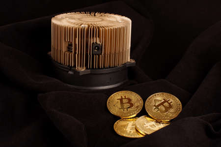 Bitcoin mining device and symbolic coins as a profit conceptの写真素材