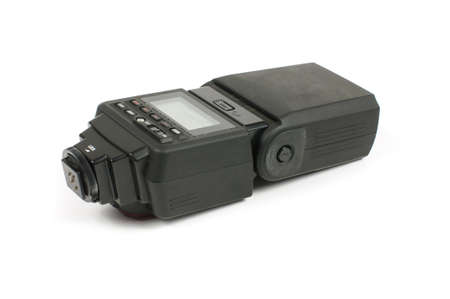 External DSLR photo camera flash called speedlight on the white backgroundの写真素材