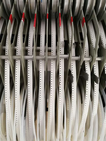 Paper reels with various electronic components resistors, capacitors, inductors close upの写真素材