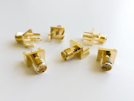 Golden SMA microwave signals connector isolated on the white background