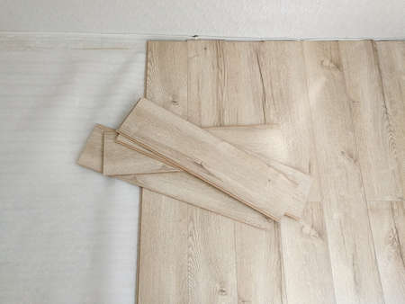 Close up of laminated flooring during replacing processの写真素材