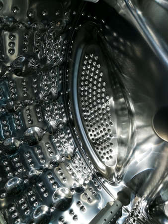 Washing machine drum with many holes internal viewの写真素材