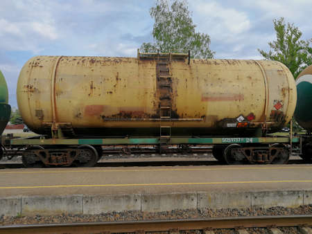 Old rustic industrial train wagons in the railroadの写真素材