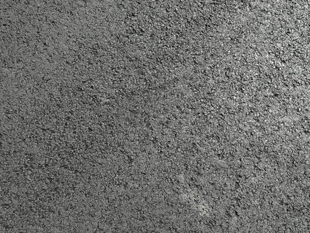 Black street asphalt texture pattern close up