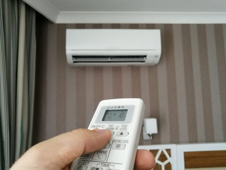 Remote control setting temperature for air conditioner on the wall