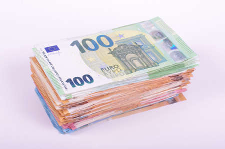 Pile of Euro banknotes isolated on the white background. Savings and financial concept.の写真素材