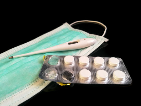 Disposable face mask for virus and bacteria protection isolated on the black background