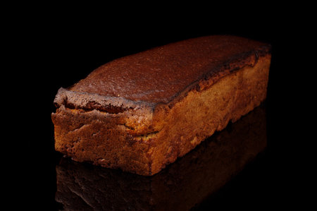 Traditional lithuanian rye bread (dark bread) loaf isolated on the black background