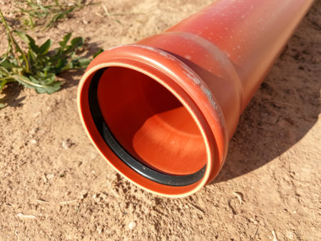 Orange pipe for house internal water canalization on the sand