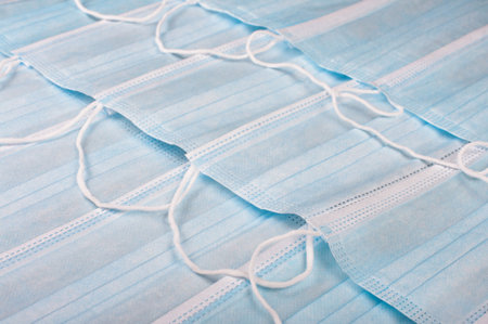 Abstract background pattern from blue medical face masks for virus protection