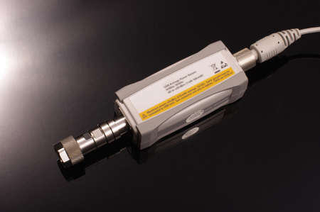 USB microwave and RF average signal power meter for precise measurements isolated on the black backgroundの写真素材