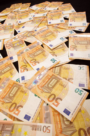 Many euro banknotes spread all over. Wealth and economy concept