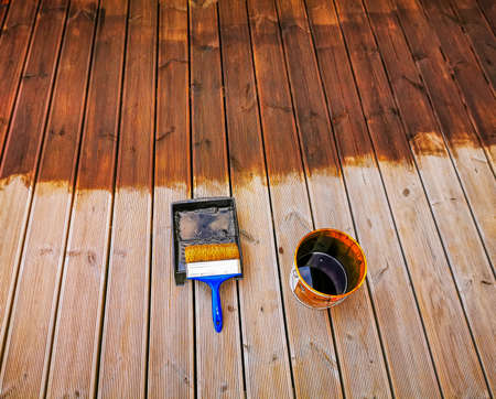 Oiling of wooden terraces before the summer seasonの写真素材