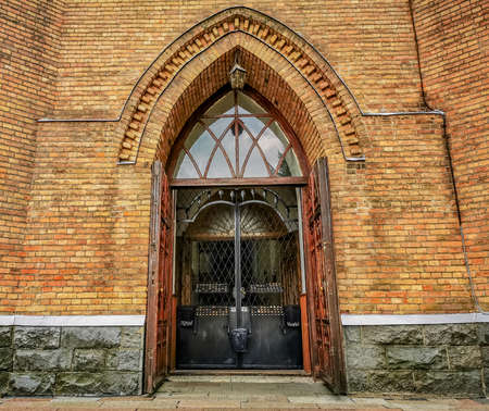 Front door of the church with candles which You can light up while church is closedの写真素材