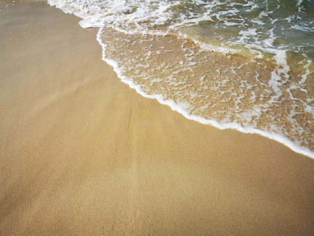 Small sea waves crashing ashore in Baltic seaの写真素材