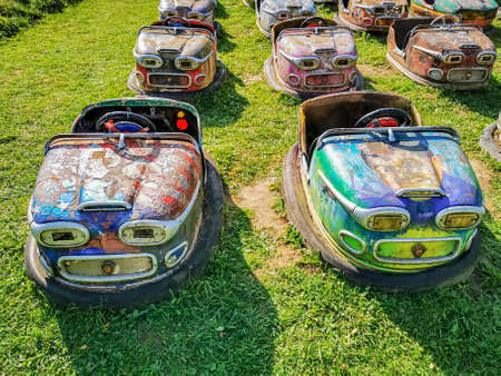 Dismantled auto drome cars from abandoned amusement park used for outdoor cinema as seatsの写真素材