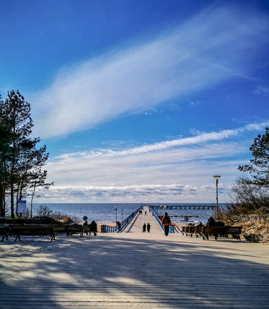 Way to the pedestrian bridge in Palanga. Blue and cloudy sky in horizonの写真素材