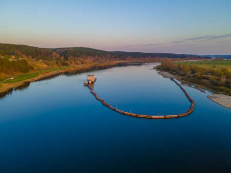Aerial view of a special ship which deepens the riverbed to make shipping available in the river. Dredging in progressの写真素材