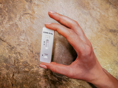 Girl holds negative Covid-19 laboratory test in her hand