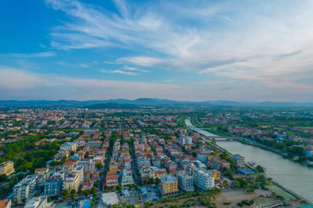 Aerial photo of the coast and canal of the resort of Rimini in the eveningの写真素材