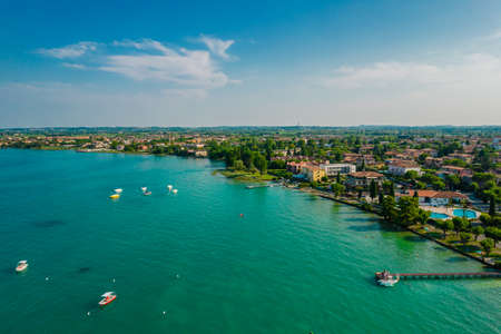 Aerial view of Sirmione resort coastline in Italy on the shore of Como lake in Lombardyの写真素材