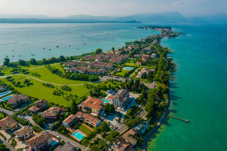 Aerial view of Sirmione resort coastline in Italy on the shore of Garda lake in Lombardyの写真素材