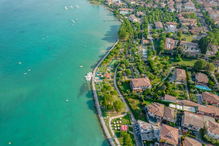 Aerial view of Sirmione resort coastline in Italy on the shore of Garda lake in Lombardyの写真素材