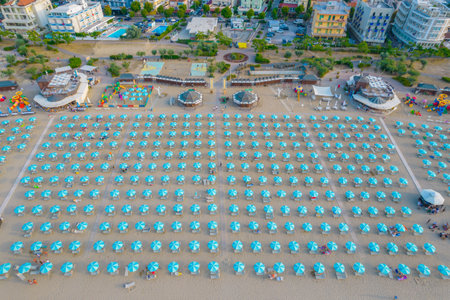 Aerial photo of Rimini coastline in the evening with many beach umbrellas in the beach.の写真素材