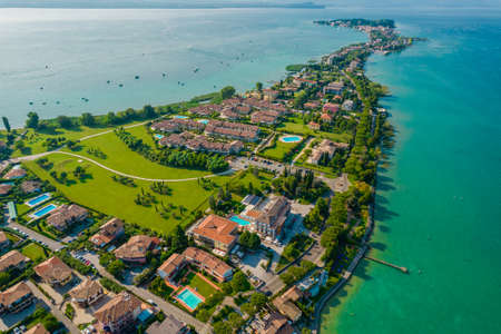 Aerial view of Sirmione resort coastline in Italy on the shore of Garda lake in Lombardyの写真素材