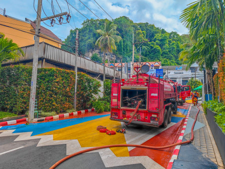 02 18 2023 - Ao Nang, Thailand. Back view of red fire truck on a fire scene in a middle of a day in...