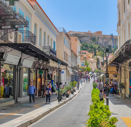 03 27 2023 - Athens, Greece. Beautiful long straight pedestrian street in Athens leading to the Acropolis on the hillのeditorial素材