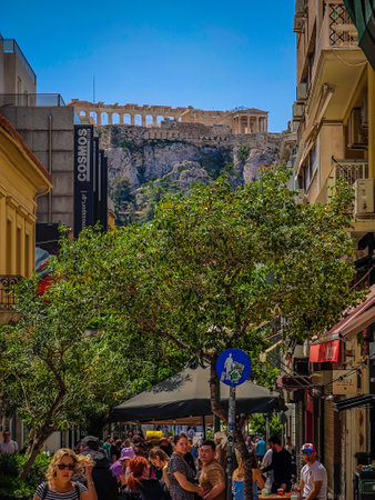 03 27 2023 - Athens, Greece. Beautiful long straight pedestrian street in Athens leading to the Acropolis on the hillのeditorial素材