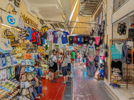 04 01 2023 - Athens, Greece. People shopping at shops of old bazaar in the Monastiraki area in Plaka, Athens. Concept of shopping, travel and vacation in Athens market.のeditorial素材