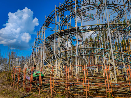 Abandoned rollercoaster in a park in middle of the city. Amusement park built during Soviet Union times in Elektrenai, Lithuaniaの写真素材