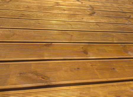 Siberian larch fluted wood terrace impregnated with oil before painting. Decking of wooden planksの写真素材