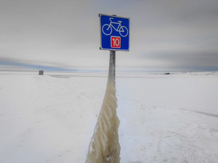 Spectacular ice formations on a cold and windy day. Natural phenomenon. Many objects in Nida town, Lithuania frozen covered by ice after a strong windの写真素材
