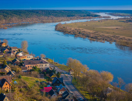 Aerial drone view of Vilkija town. A small settlement in Lithuania along the river of Nemunas and...
