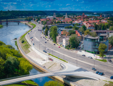 Kaunas old town, Lithuania. Panoramic drone aerial view photo of Kaunas city center with new pedestrian bridge to science museum in Nemunas islandの写真素材