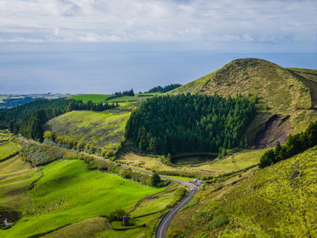 Scenic landscape with mountains and ocean of Sao Miguel Island, Azores, Portugal. Aerial drone view of panoramic islandsの写真素材