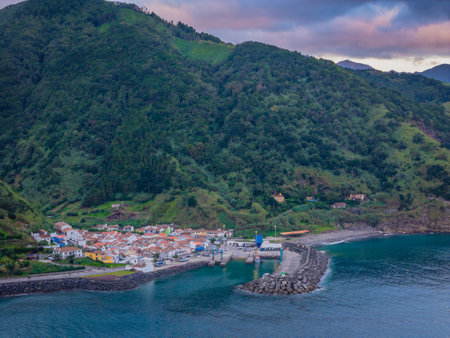 Aerial drone view of Ribeira Quente and Praia do Fogo with volcanic black sand beach. Landscape of Sao Miguel coastline with green mountains in Azoresの写真素材
