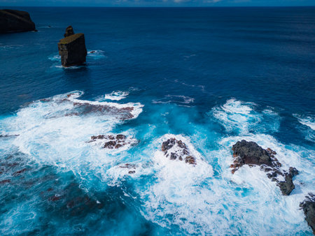 Rocks, cliffs, waves and turquoise water in Atlantic ocean, Mosteiros, Azores islands. Aerial drone...