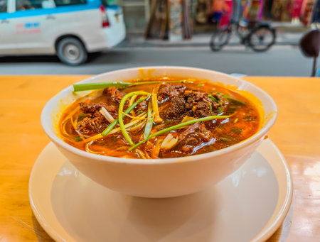 Pho soup with noodles and beef meat bowl at a local Vietnamese street food restaurant. Authentic Vietnamese street food, Vietnamese cuisineの写真素材