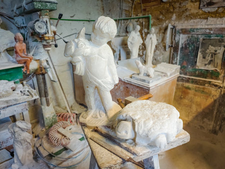 Workshop of gypsum alabaster rock in Volterra, Italy, Tuscany region. Carvings of alabaster, a soft rock mineralの写真素材
