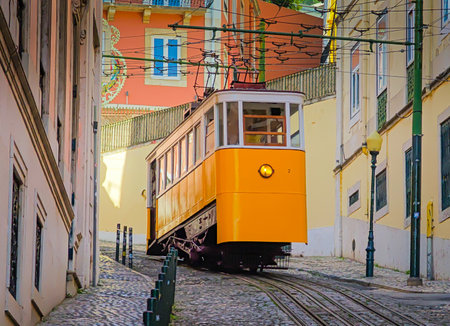 Gloria Funicular in Lisbon. Tram with a wood brass interior climbing a steep hill to Miradouro de Sao Pedro de Alcantaraの写真素材