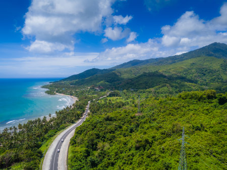 Exotic palm tree coastline road to El Nido at Palawan island, Philippines. Aerial drone photo. Open road trip from Puerto Princesa to El Nidoの写真素材